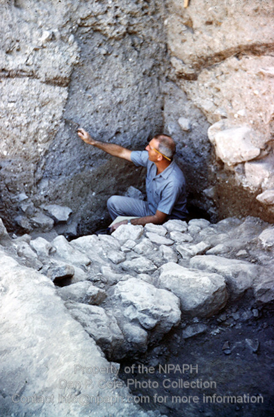 Fld VI.2; Balk showing pit dug from 12th c. down to 16th c. BCE layers (Photo taken of Cole on his camera by someone else). (1962, ID: cColepShechem016, Source: slide, Repository: NPAPH-project, Creator(s): Dan P. Cole)
