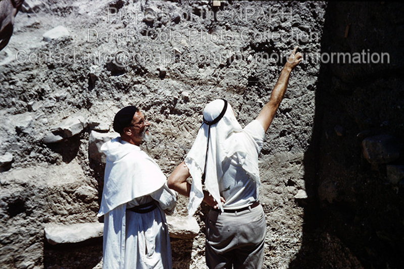 Fld VI.2; Area supervisor with visiting archaeologist Pere Roland de Vaux, Director of the Jerusalem French Dominican École Biblique, examining pit shown in No.16. (1962, ID: cColepShechem017, Source: slide Repository: NPAPH-project Creator: Dan P. Cole)