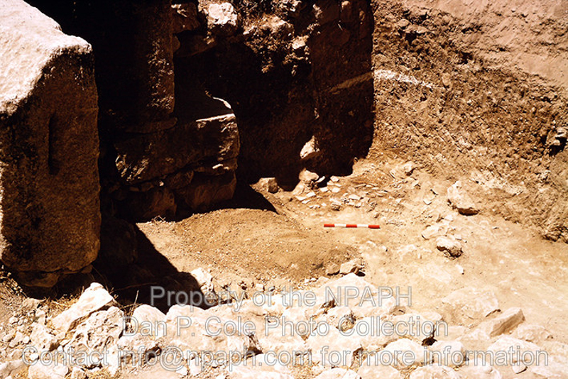 Fld I.4; Meter stick near 2 skeletons fallen in east gate during siege. (1966, ID: cColepShechem043, Source: slide, Repository: NPAPH-project, Creator(s): Dan P. Cole)