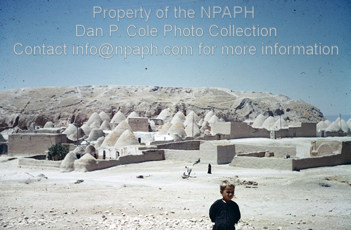 Homs area (Syria); Village of mud-brick “beehive” homes cut into ancient tell. (1962, ID: cColepvarious049, Source: slide, Repository: NPAPH-project, Creator(s): Dan P. Cole)