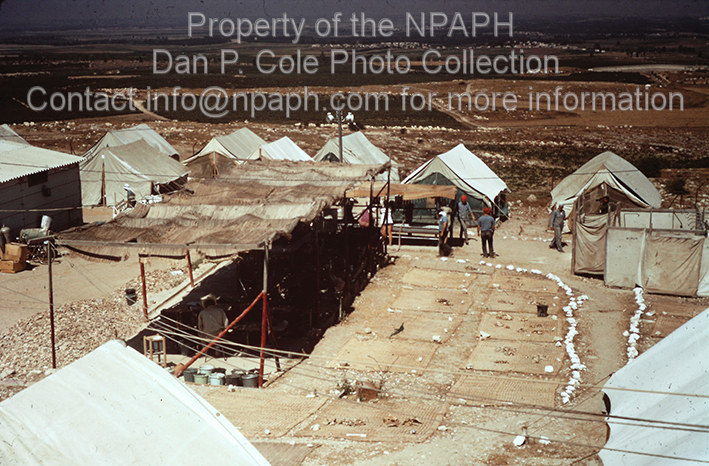 Camp; Canvas-covered pottery shed, potsherd drying area, showers. (1966, ID: cColepGezer055, Source: slide, Repository: NPAPH-project, Creator(s): Dan P. Cole)