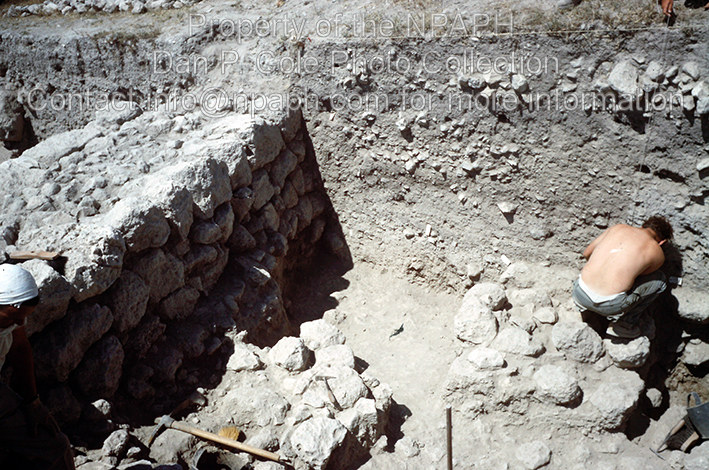 Fld I; This volunteer was using a patish to shave a smooth vertical face at the balk, with aid from a plumb line held at the surface by another. (1968, ID: cColepGezer062, Source: slide Repository: NPAPH-project Creator(s): Dan P. Cole)