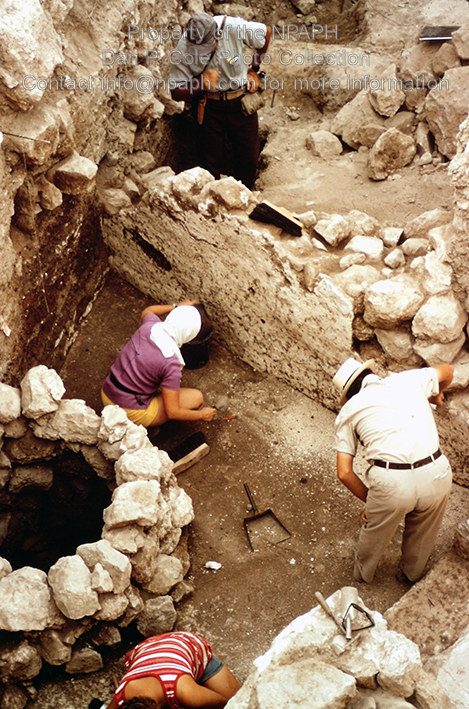 Fld III; Volunteer clearing dirt from 18th c. BCE wall plaster. (1971, ID: cColepGezer070, Source: slide, Repository: NPAPH-project, Creator(s): Dan P. Cole)