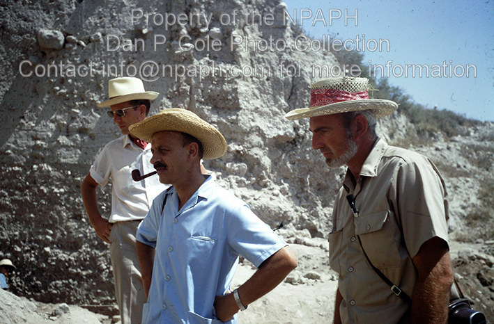 Fld II; Yigael Yadin, Israeli archaeologist general (with pipe) touring the excavations with Director William Dever (left) and field supervisor (Cole). (1968, ID: cColepGezer087, Source: slide, Repository: NPAPH-project, Creator(s): Dan P. Cole)
