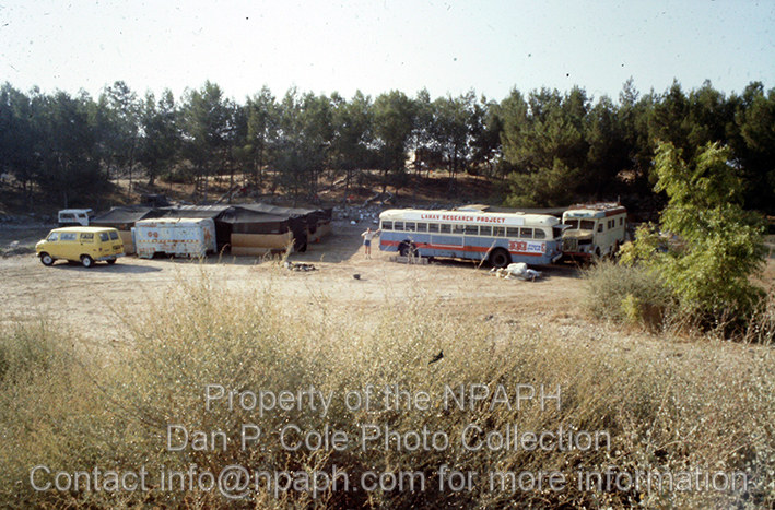 Camp; On a lean budget this dig used derelict vehicles from nearby Kibbutz Lahav's junkyard for kitchen, workroom and office facilities. (1980, ID: cColepHalif096, Source: slide, Repository: NPAPH-Project, Creator: Dan P. Cole)