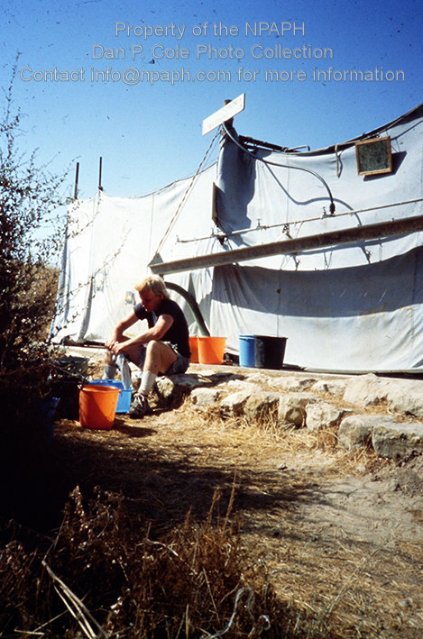 Camp; Some used free time to wash clothes outside the shower area. (1980, ID: cColepHalif100, Source: slide, Repostitory: NPAPH-project, Creator: Dan P. Cole)